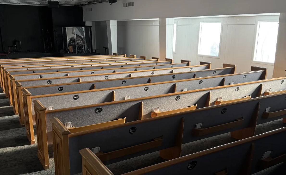 Tap.Giving NFC plates installed on pew backs at a church