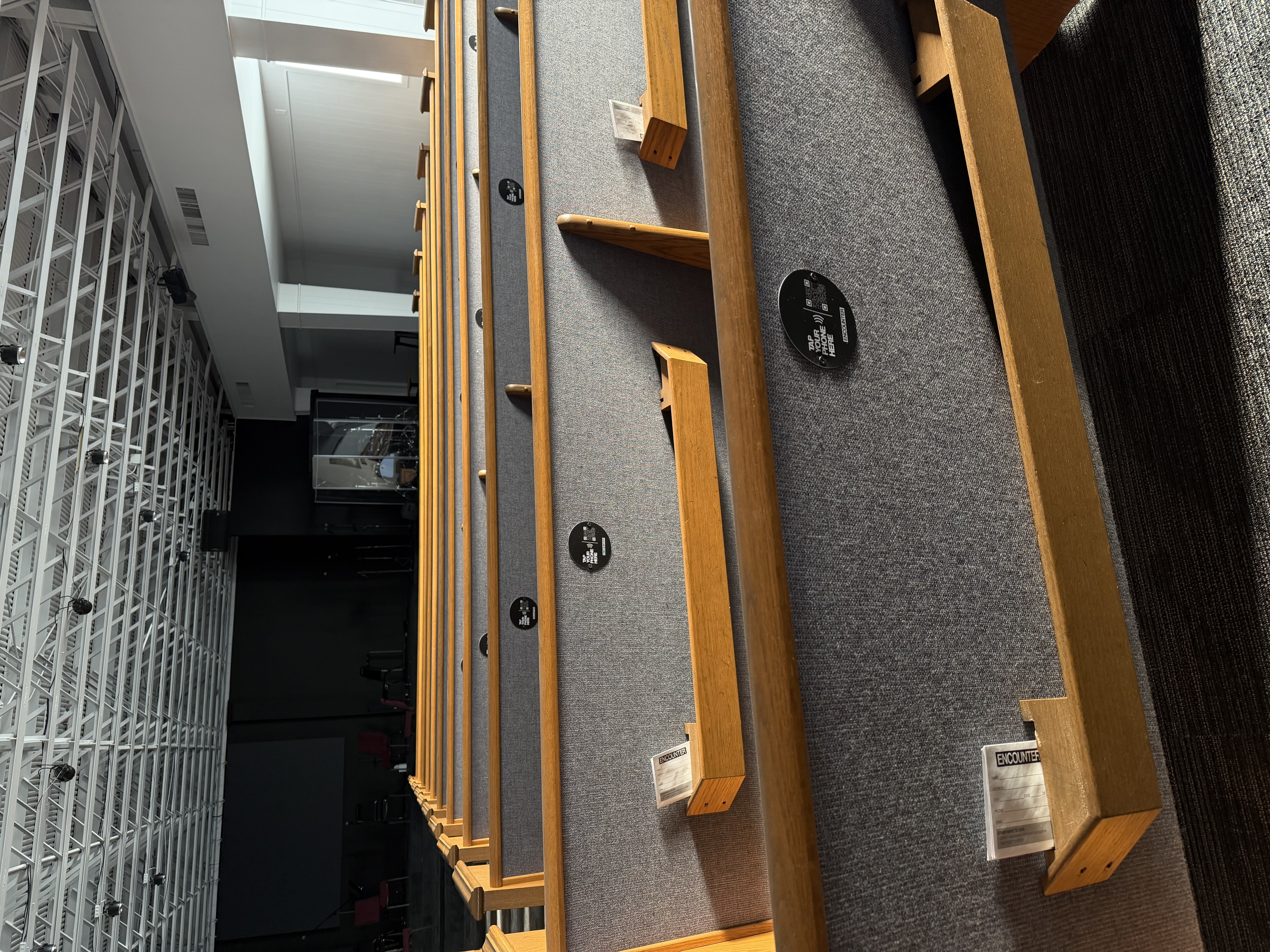 Warm, intimate church pew setting in a small community church