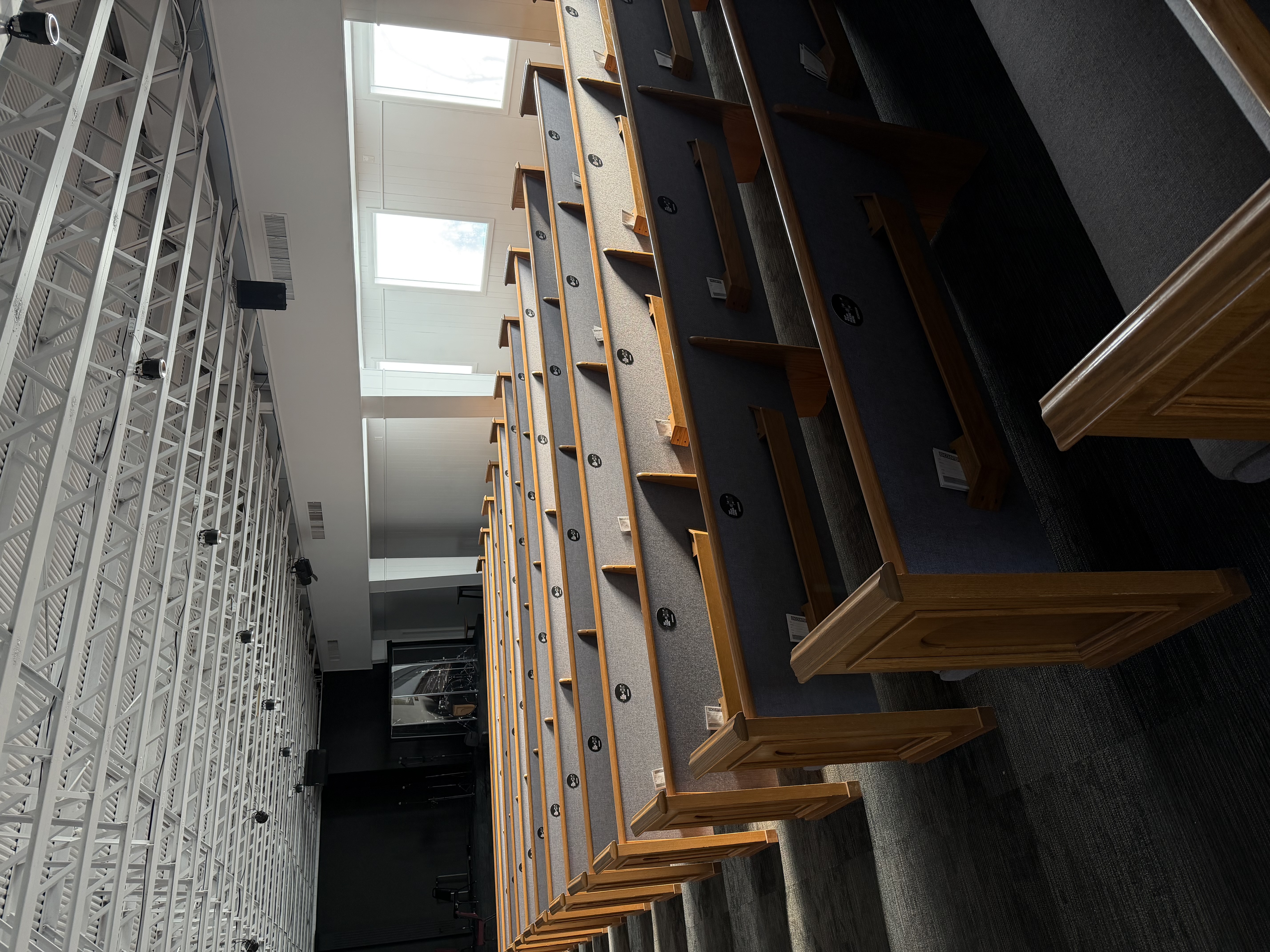 Church sanctuary with wooden pews ready for year-end services